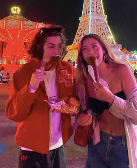 sunny suljic eating hotdog with a girl