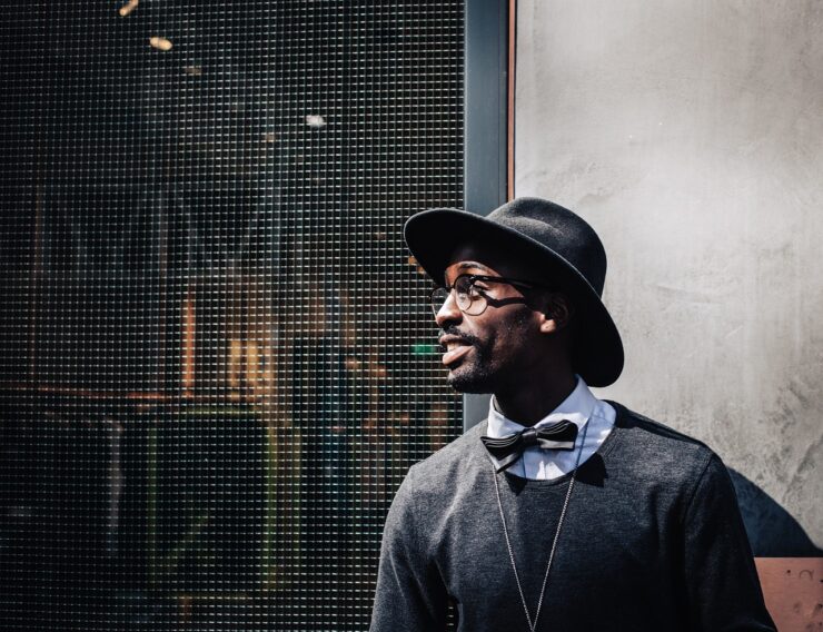 Fashionable African-American man wearing a fedora. Depiction of Big Hats in Stylish Outfits.