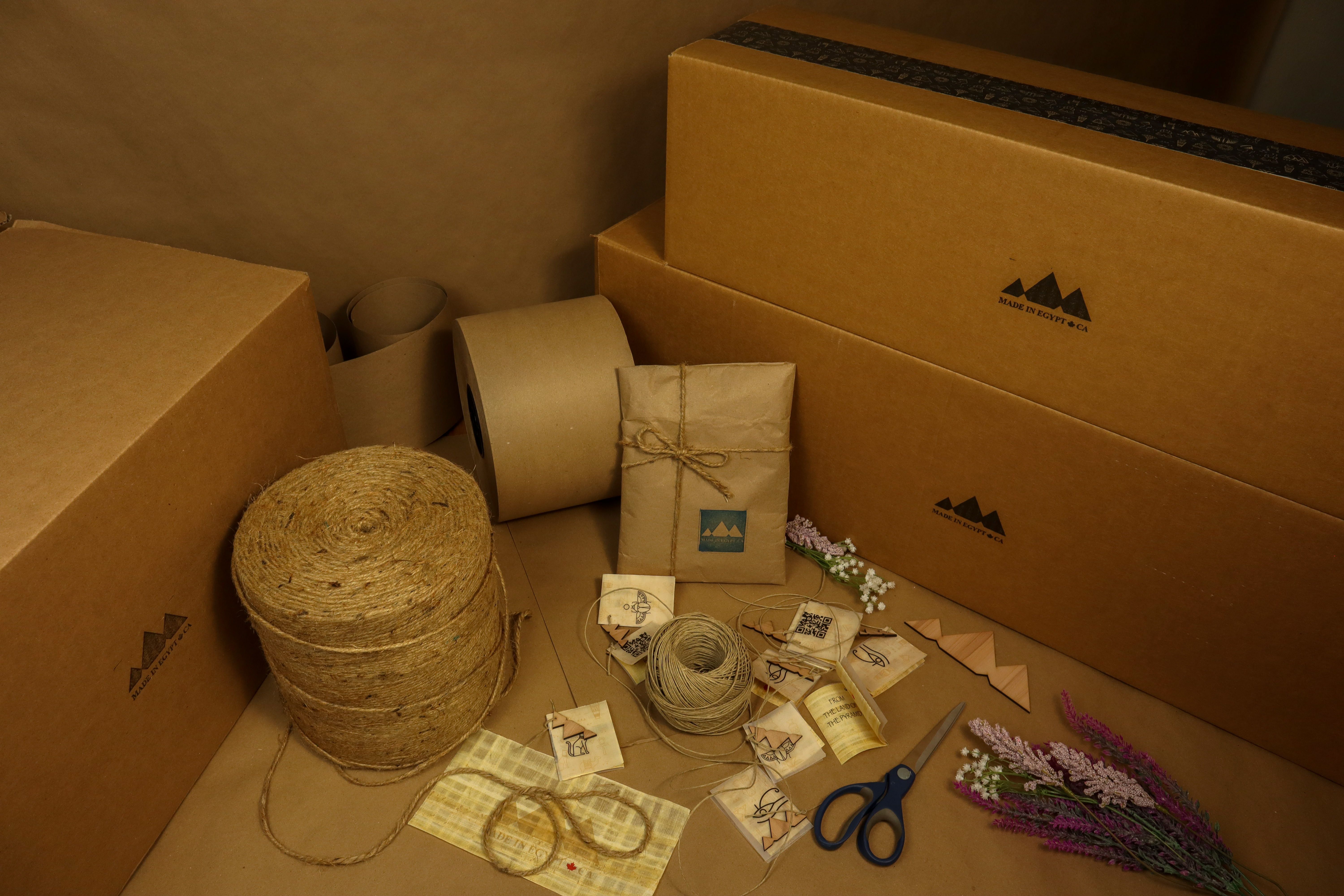 Eco-friendly packaging materials including boxes, kraft paper and twine for sustainable shipping